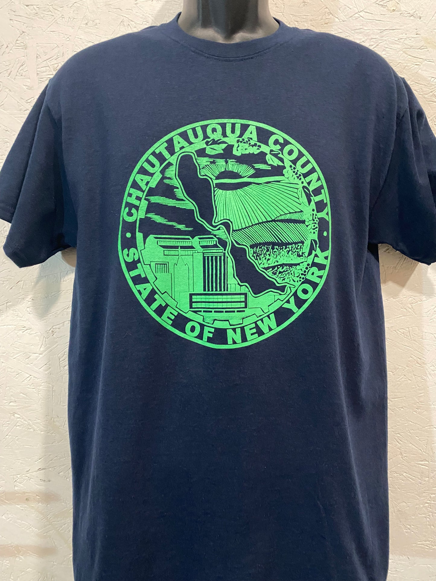 Chautauqua County Crest Tee - Lite Green on Navy