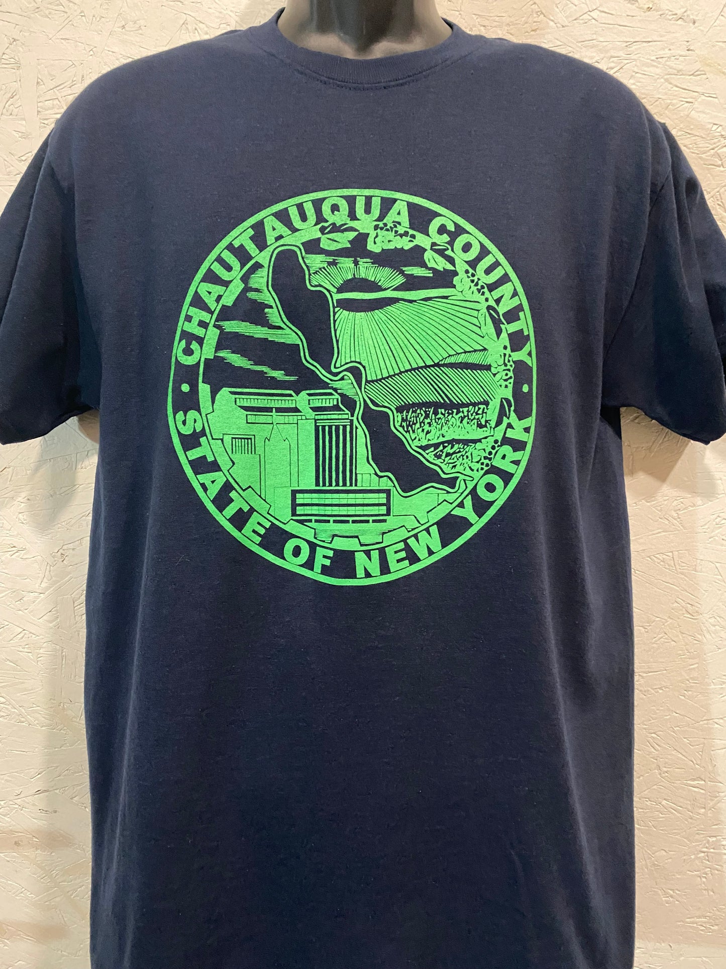 Chautauqua County Crest Tee - Lite Green on Navy