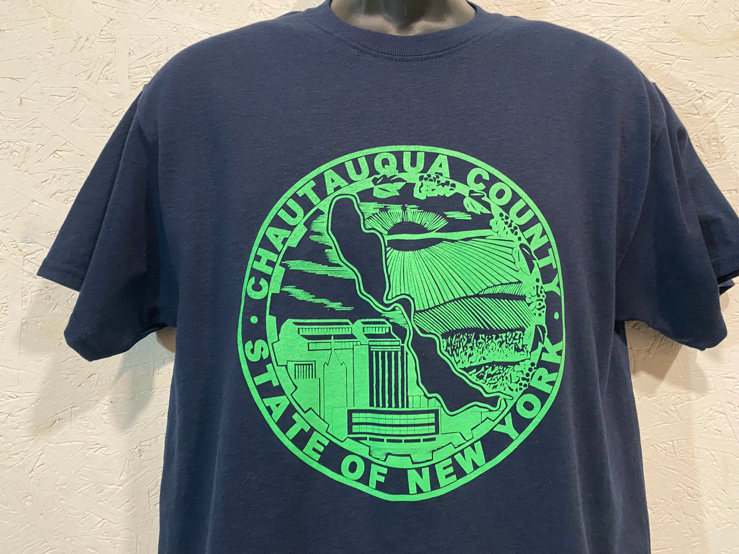 Chautauqua County Crest Tee - Lite Green on Navy